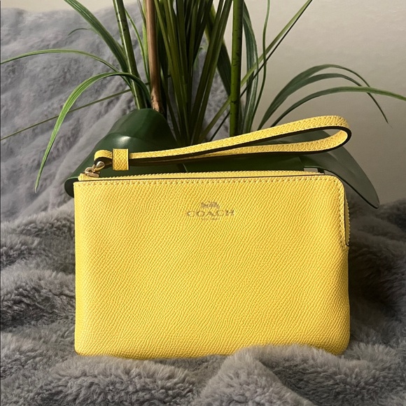 Coach Handbags - Coach Sunny Yellow Wristlet NWOT retail $88